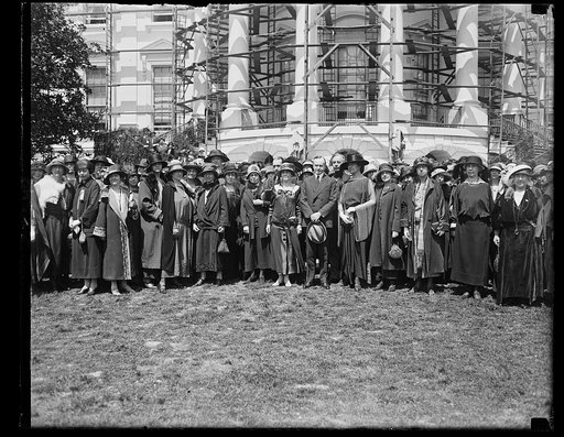 Calvin Coolidge and group outside White House (with scaffolding), Washington, D.C.
