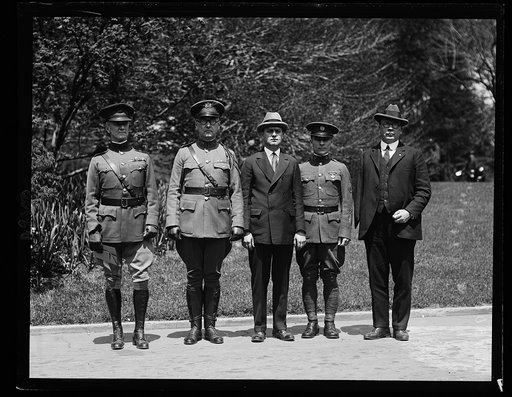 Pres. Coolidge, who will make the dedication of the 1st Div. Memorial Monument in Wash. in Oct., was today made an Honorary Member of the Society of the 1st Div. A.E.F., District of Columbia Branch. Left to right: Col. James A. Drain, Sgt. David Friesel, Capt. C.S. Ryan, Capt. C.S. Coulter and Gen. 
