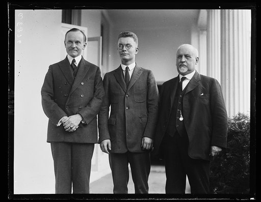Calvin Coolidge and] student of the [...] Dakota, who won the prize for his essay on the subject "The True Functions of Government." Papers were reviewed by the Commissioner of Educ. Prize was in form of free trip to Wash. shown here with Pres. Coolidge [White House, Washington, D.C.