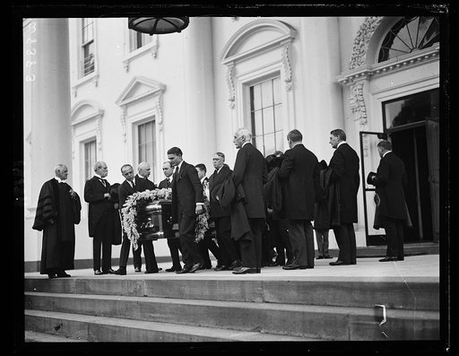 ...] through a lane of cabinet members by honorary pall bearers. To Arlington Nat'l Cemetery
