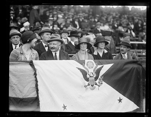 Group seated in presidential seats at stadium