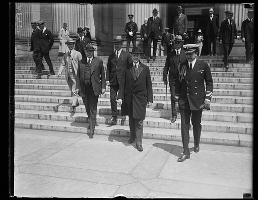Pres. Coolidge leaving the Nat'l Museum where he addressed the Nat'l Outdoor Recreation Conf. Left to right: Secy. Hoover; Richard Jarvis; Pres. Coolidge; Secy. Slemp; and Capt. Andrews