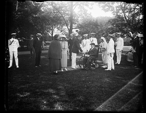 Pres. and Mrs. Coolidge receiving the disabled men in the Army, Navy and Public Health hospitals in the vicinity of Wash., at a garden party given for them at the W.H. [i.e., White House], June 5