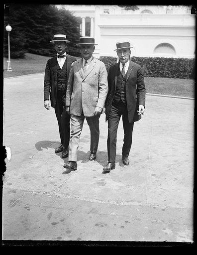 Officers of the Nat'l Federation of Post Office employees called on Pres. Coolidge, June 5, to urge the passage of a bill raising the pay of 350,000 Post Office Clerks before Congress adjourns. Left to rt.: Leo. E. George, Thos. F. Flaherty, and Louis C. Woolf