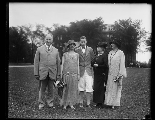 Mrs. Coolidge attends the graduation of her oldest son at the Mercersburg Academy, Mercersburg, Pa. In the grp., left to right: W.M. Irvine, headmaster of the school; Mrs. Coolidge; John Coolidge; Mrs. Frank Stearns and Mrs. Wm. Irvine, wife of the headmaster