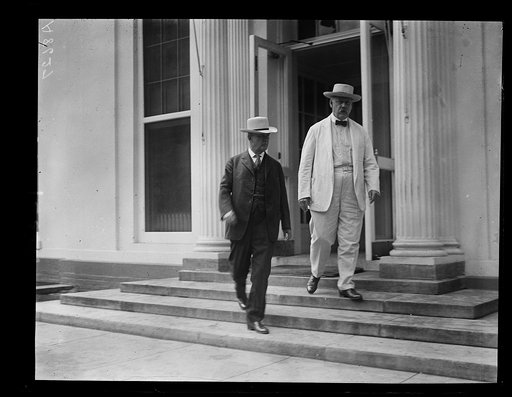 Secy. of War Weeks and Postmaster Gen. New leaving the W. H. [i.e., White House] after extending their sympathy to Pres. and Mrs. Coolidge on the death of Calvin Coolidge, Jr.