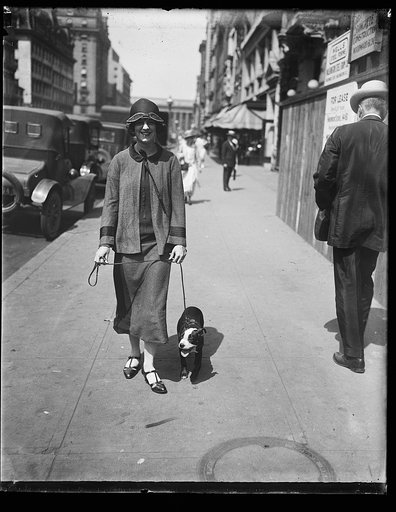 Street scene, young woman with dog, Washington, D.C.