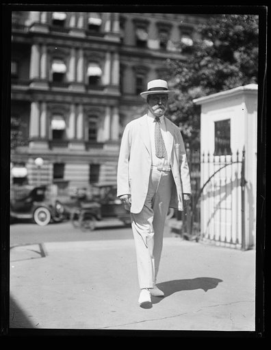 Charles Evans Hughes; State, War and Navy building in background, Washington, D.C.
