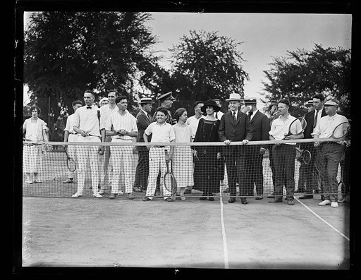 Grace Coolidge and Calvin Coolidge with group at tennis court