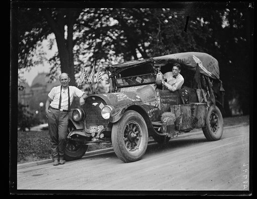 Automobile with graffiti, including "Davis," "Keep Off," "Hobo King," "Hands Off,"  "Traveling DeLux," "Jeff Davis," and the "Hobo King" on left side of car