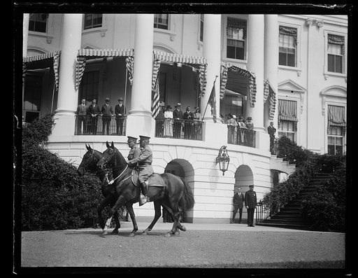 President and Mrs. Coolidge, Teddy Roosevelt, Jr., and others on balcony watching procession at White House, Washington, D.C.