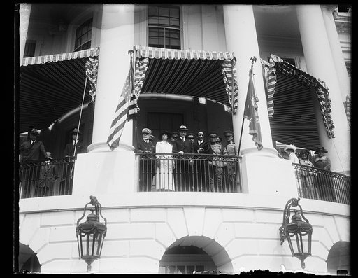 President and Mrs. Coolidge, Teddy Roosevelt, Jr., and others on balcony watching procession at White House, Washington, D.C.