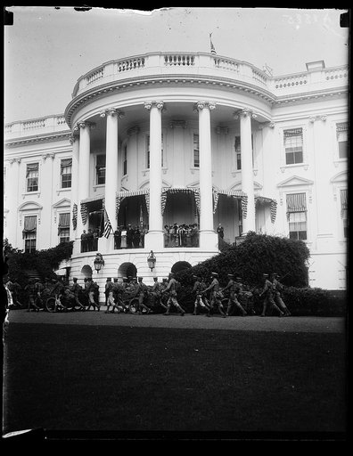President and Mrs. Coolidge, Teddy Roosevelt, Jr., and others on balcony watching procession at White House, Washington, D.C.