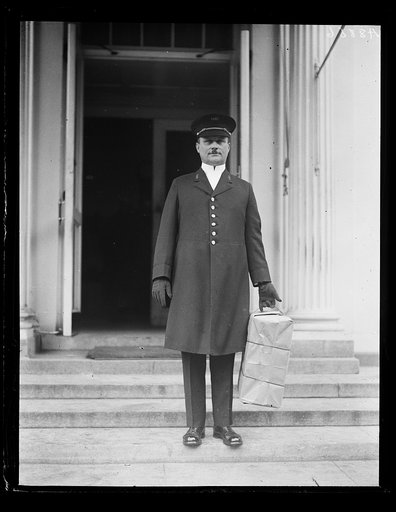Man with package at White House, Washington, D.C.