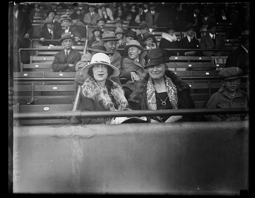 Women seated in stadium stands