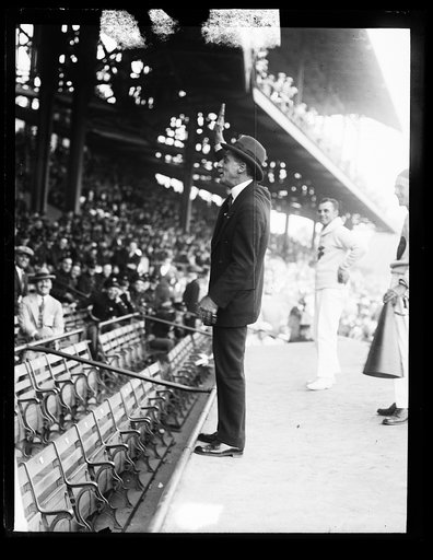 Man waving to spectators in stadium