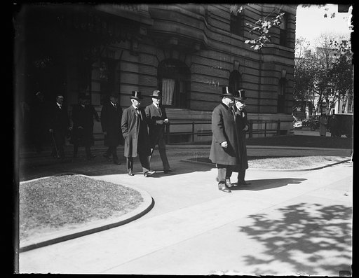 Men exiting building; William H. Taft and Oliver Wendell Holmes, right