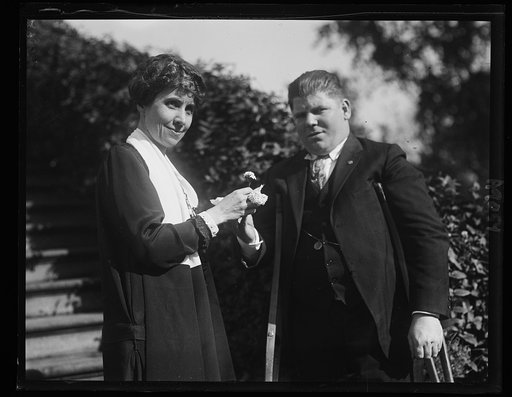 Mrs. Coolidge receiving the first Forget-me-Not from Leo B. Clark, wounded veteran, to be worn on Disabled Amer. Veterans Day, Nov. 8th [White House, Washington, D.C.