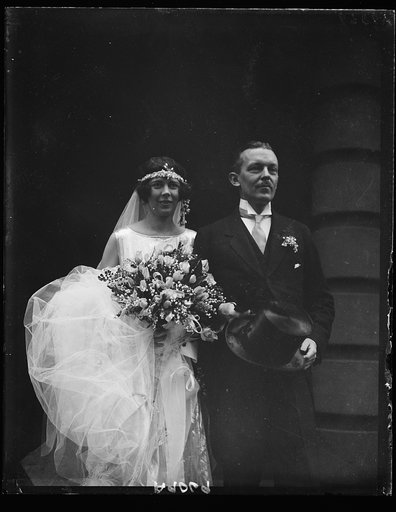 Mr. and Mrs. Sommerville Pinckney Tuck, leaving St. Thomas' Church, Wash., following wedding ceremony, Oct. 25. Mrs. Tuck, nee Beatrice Beck, daughter of the Solicitor Gen. and Mrs. Jas. M. Beck