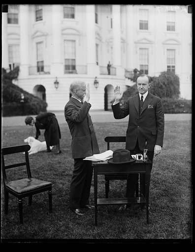 Unidentified man with Calvin Coolidge outside White House; Grace Coolidge in background. Washington, D.C.