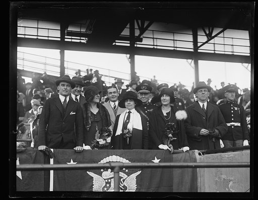 Group in stadium stands; Grace Coolidge, center. Washington, D.C.