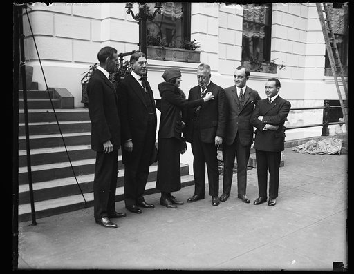 Group; includes Curtis D. Wilbur, 2nd from left