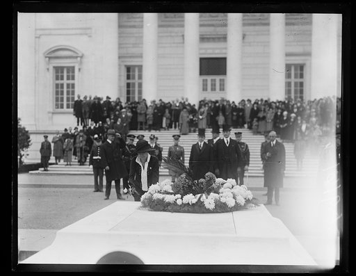 Grace Coolidge placing flower on Tomb of Unknown Soldier, Arlington National Cemetery, Arlington, Virginia