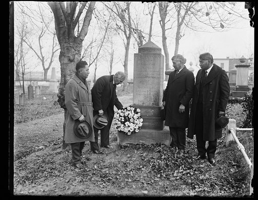 Placing flowers on gravestone of Push Ma Ta Ha, a Choctaw Chief