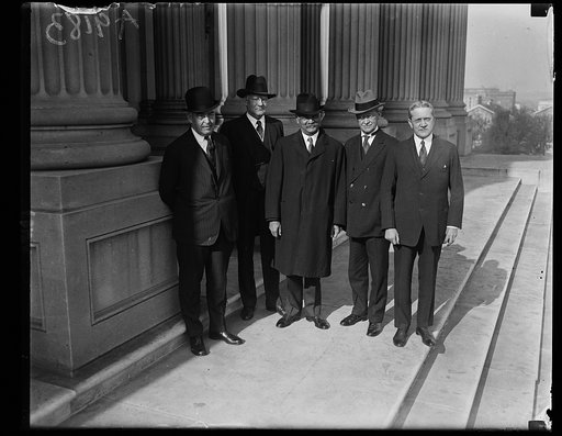Senators on Capitol steps after meeting in caucus, Friday morning, Nov. 28, when Sen. Curtis was elected leader of the Senate, to succeed the late Sen. Lodge. Left to rt.: Wm. M. Butler, new Sen. from Mass., Sen. James Watson of Ind., Sen Chas. Curtis of Kansas, Sen. J.H. Metcalf from R.I. to succee