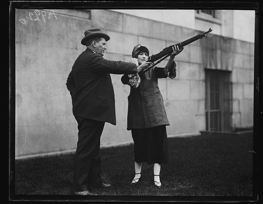 Man and woman with rifle?