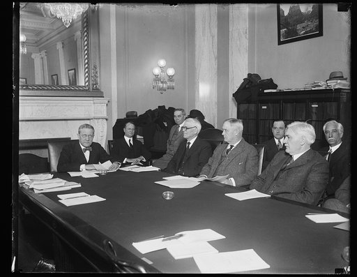 Group at table; Harry S. New, 4th from right