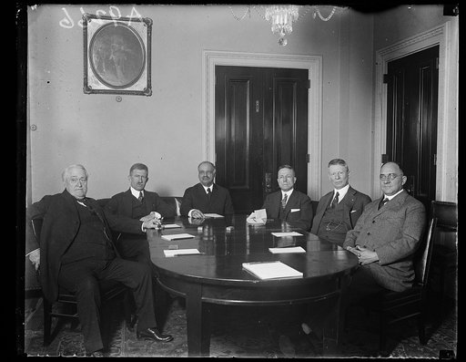 Group at table; Charles Curtis, center