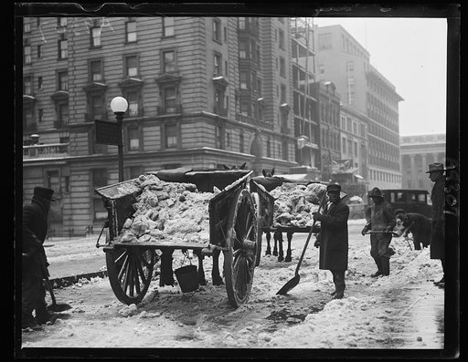 Snow removal; wagons with snow and men with shovels on snow covered street, Washington, D.C.