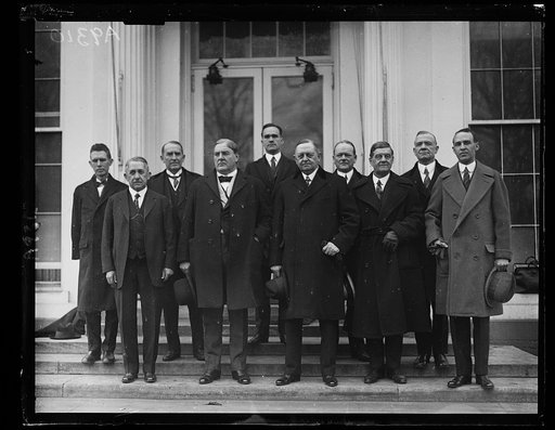A Congressional Delegation from the state of Alabama called on President Coolidge today, Jan. 15th, to urge the appointment of M.M. Caskie, of that state, to the Interstate Commerce Commission. Left to right, front row: Rep. E.B. Alman, Senator J. Thomas Heflin, Senator Oscar W. Underwood, Rep. W.B.