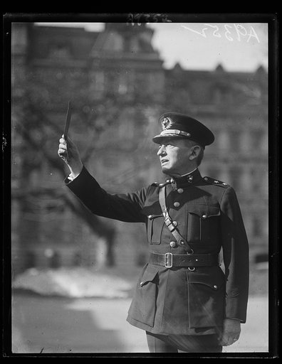 General John A. LeJeune, Commandant of the U.S. Marine Corps, viewing the eclipse in front of the Navy Department at Washington