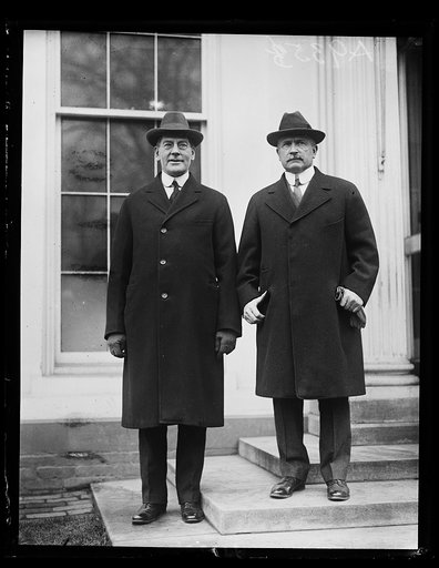 Secretary of the Navy Curtis D. Wilbur (left) [...] who presented Admiral S.S. Robison, (right) in charge of the battle fleet to President Coolidge on January 26. Secretary Wilbur and Admiral Robison were born on the same day and were classmates at Annapolis [White House, Washington, D.C.