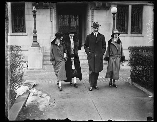 The new French Ambassador to the United States, who succeeds the late Dean of the Diplomatic Corps at Washington, Mr. Jules Jusserand, and his family leaving the French Embassy shortly after their arrival. Left to right are: Irene, Madame Daeschner, the Ambassador and Antonette Daeschner