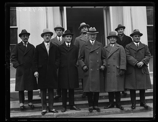 Governor Towner of Porto [sic] Rico with [..]ers of th [...] Porto [sic] Rican cabinet as they appeared at the White [...] to discuss legislative matters with President Coolidge. In the [...]t row, (left to right) Gonzales Mena, Senator-Elect; M. Guerra Mondrago [...] speaker of the House; Felix Cor