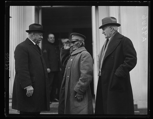 Noted Indian scout visits White House. I-See-O, veteran Indian Scout, who has served 50 years in the U.S. Army is shown saluting the Secretary of War, J[...] Weeks at the White House, where he called to pay his repec[...] President Coolidge with other members of Kiowa Tribe. I-See-O, 79 years old an