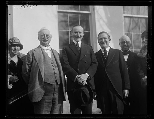 An invitation was extended by members of the Texas Chamber of Commerce to President Coolidge, today, Feb. 4th, to attend the [...]eting of the West Texas Chamber of Commerce at Mineral [...]as, May 4-6. Left to right, Col. C.C. Walsh, Pres. [...] Chamber of Commerce, President Coolidge and Senator S