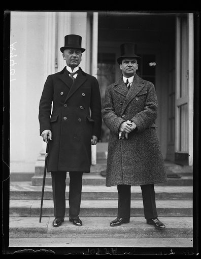 The Serbian Minister, Dr. Tresich Pavichich, (left) at the White house today to present the famous Jugoslav viol[...] Zlatko Kalokovic, (right) to President Coolidge. The violin[...] is in this country on a concert tour