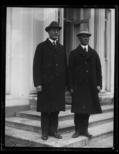 The Secretary of the Navy, Curtis D. Wilbur, (left) and Admiral C.T. Vogelson were callers today at the White House. The Admiral has just returned from Brazil where he helped to reorganize the Brazillian Navy
