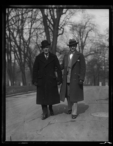 Among the callers at the White House today to see President Coolidge was Sammy Mandell, (right) new Lightweight Champion of the United States, with his Manager Eddie Kane, who also manages Tommy Gibbons