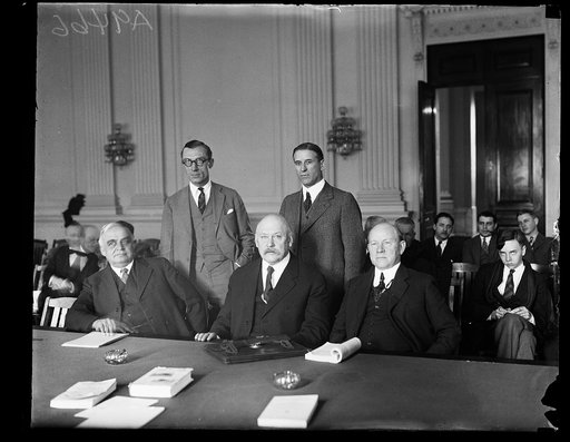 Group at table; John W. Weeks, center