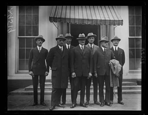 The Brazilian mission, headed by Gen. Pershing, called upon Pres. Coolidge, March 18th. Front row, left to right: former Rep. Fred C. Hicks, Gen. Pershing, Admiral J.H. Dayton. Back row, left to right: R.E. Knox, Secy., Commander John R. Bearsdall, U.S.N., Major Ed. Bowditch and Major John Quakemeye