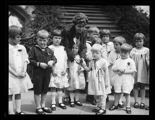 Grace Coolidge and group of children outside White House, Washington, D.C.