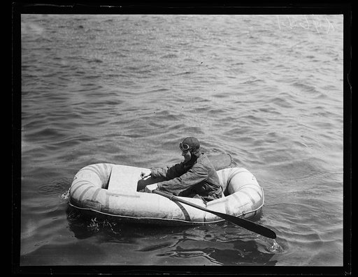 Man rowing inflatable boat