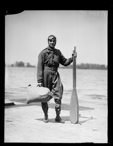 Man with oars near water