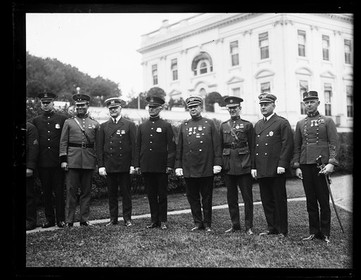 These men whose names throw fear into the hearts of criminals in their respective countries paid their respects to President Coolidge, May 25th. They are, (left to right) [...] Alcantara, Honduras, Inspector J. O'Conner, New York City; [...] L. Walter, White House Police, Inspector General C.H. McKi