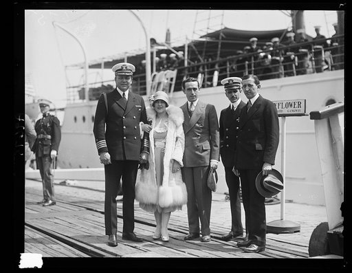 The famous screen star Harold Lloyd, visited Washington, D.C. Unannounced, May 16th and with his wife and Will Hays, czar of the movies made a visit to the Navy Yard. The picture was made in front of the President's Yacht, "The Mayflower." Left to right: Captain Adolphus Andrews of the "Mayflower"; 